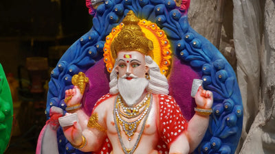 Vishwakarma Day celebration with decorated tools, flowers, and traditional puja setup 