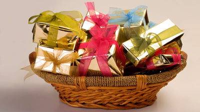 Christmas gifts arranged under decorated tree with filled stockings for holiday checklist 