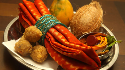 Arranged pooja samagri with diyas, flowers, incense and traditional Hindu worship items 